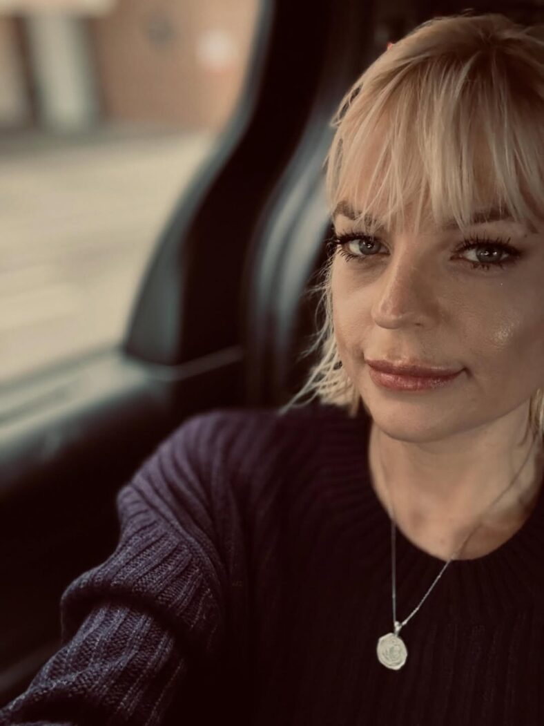 Kirsten Storms takes a selfie in a car