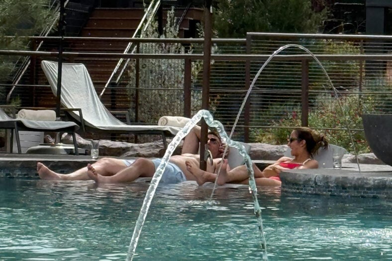 Dianna Russini and Mike Vrabel poolside.
