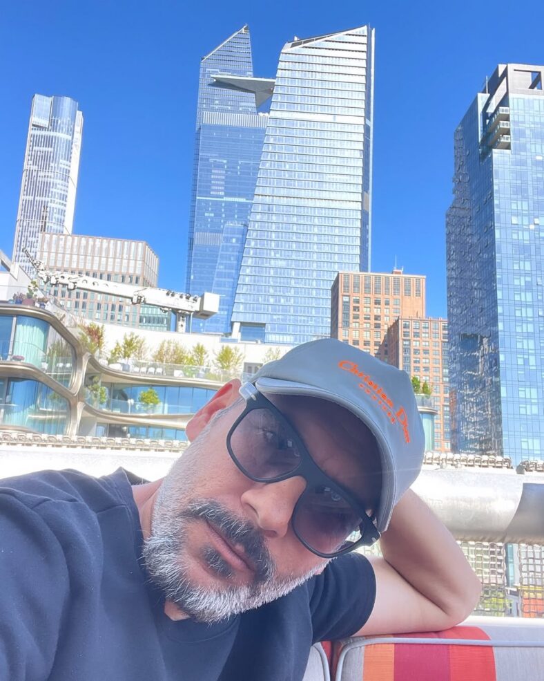 Nik Richie takes selfie in front of buildings