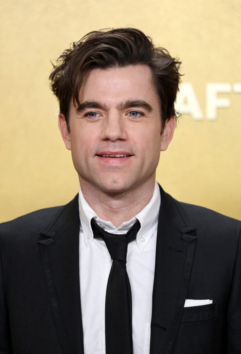 Patrick Ball, The Pitt, posing on the red carpet. 