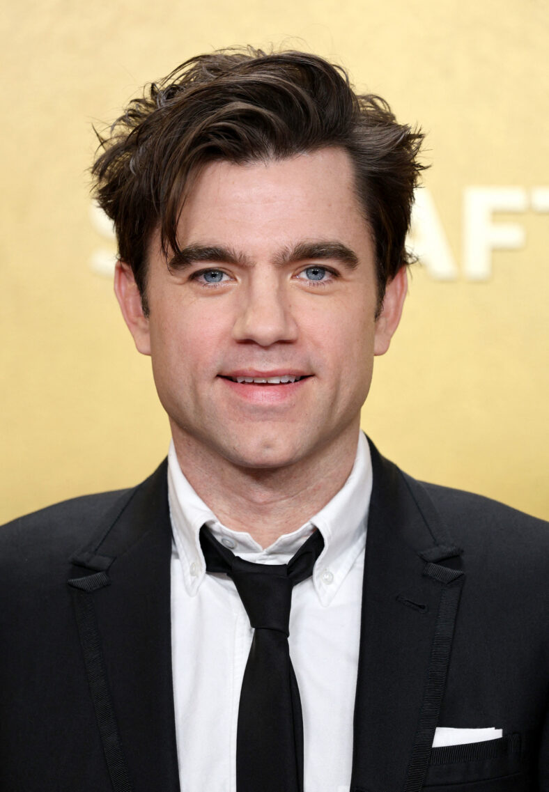 Patrick Ball, The Pitt, posing on the red carpet. 