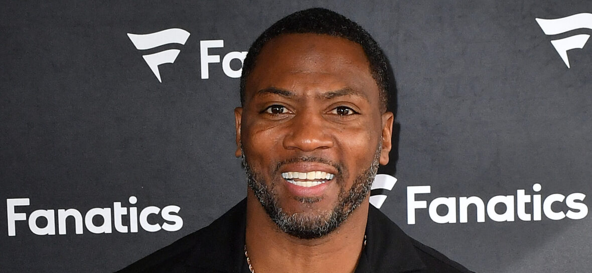 Ryan Clark posing on the red carpet.