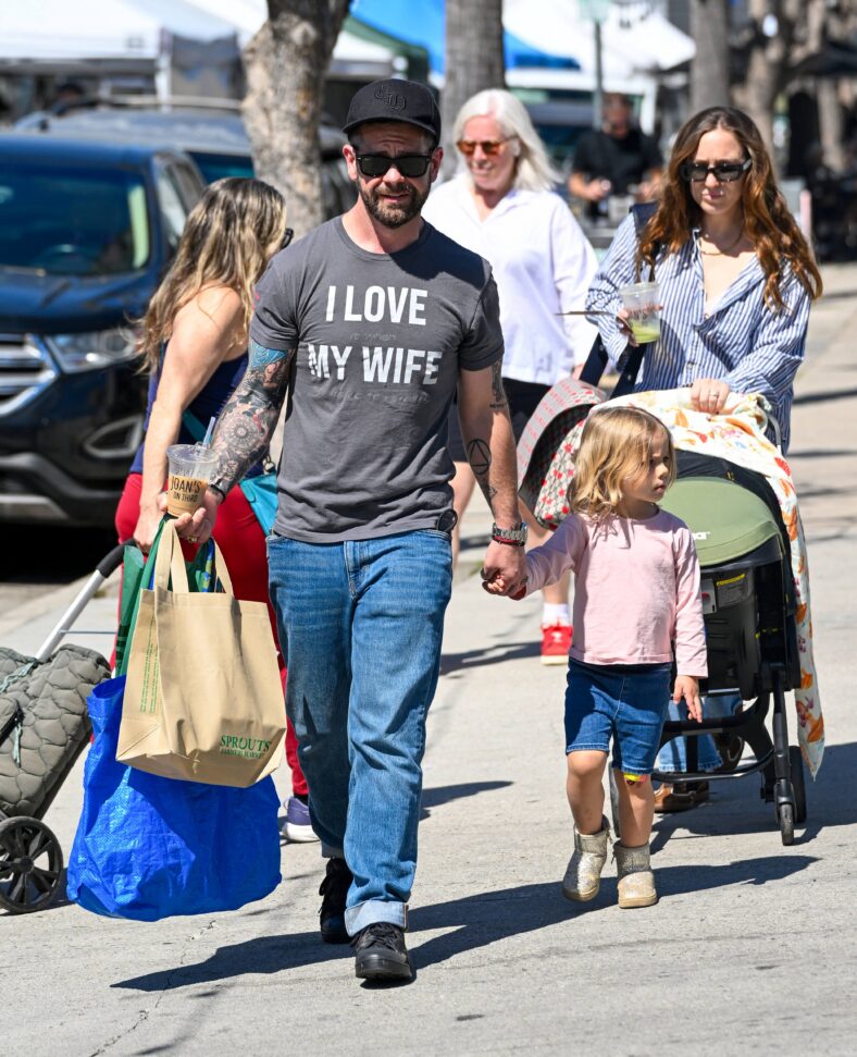 Jack Osbourne shows off his slim figure as he steps out with his wife and new baby Ozzy in tow