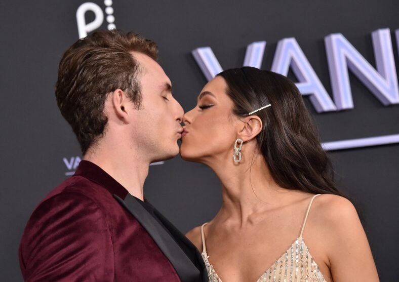 James Kennedy and Ally Lewber kissing on the lips on the red carpet. 