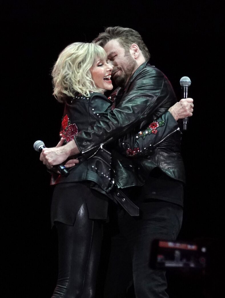 John Travolta and Olivia Newton John recreate their iconic Grease characters in full costume at the Meet N Grease sing-a-long in West Palm Beach