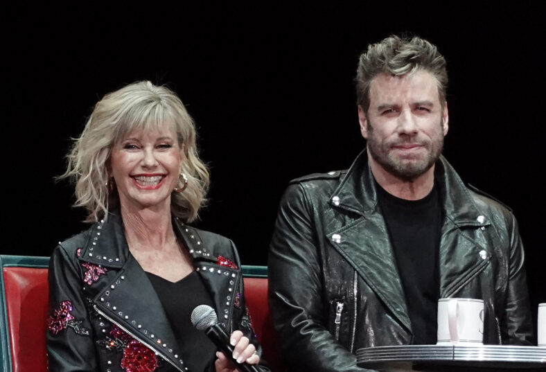 John Travolta and Olivia Newton John recreate their iconic Grease characters in full costume at the Meet N Grease sing-a-long in West Palm Beach