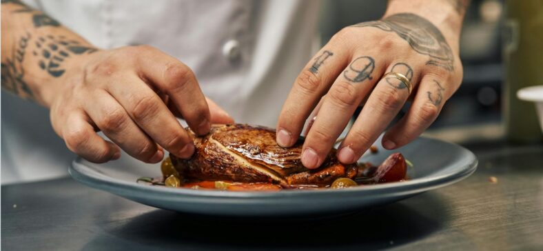 Chef plating steak