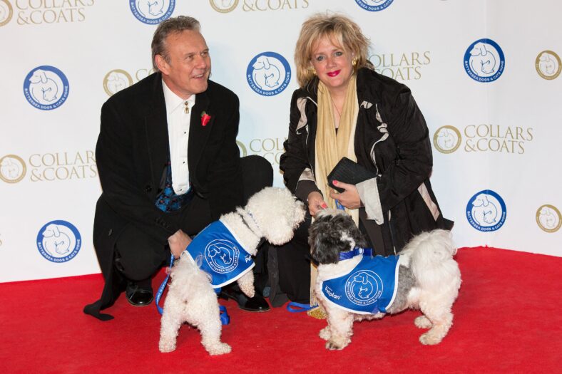 Sarah Fisher and Anthony Head with a dog