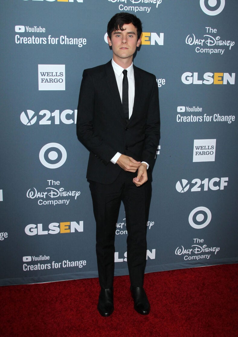 Connor Franta posing on the red carpet.
