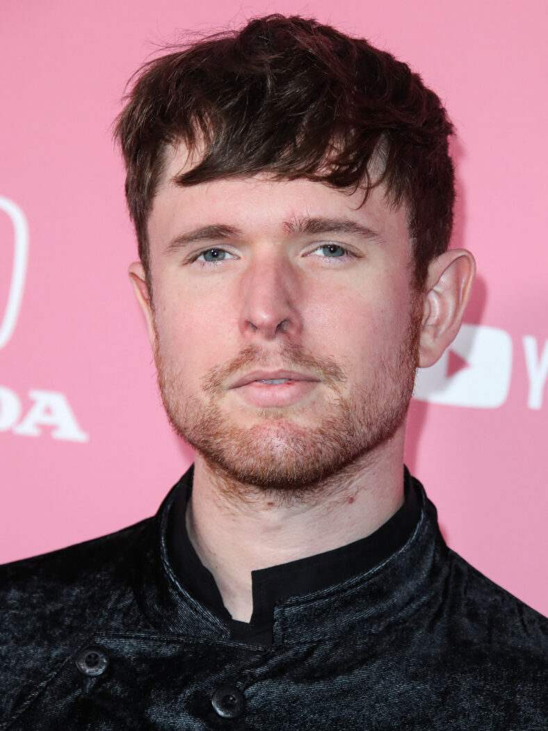 James Blake posing on the red carpet.