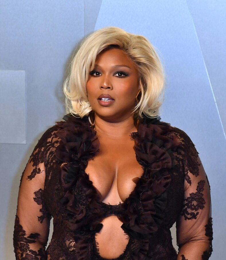 Lizzo posing on the red carpet. 