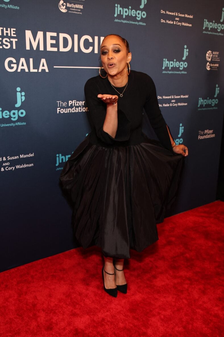 Tia Mowry posing on the red carpet. 