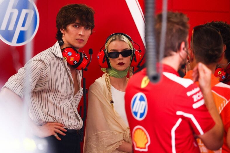 Anya Taylor-Joy and Malcolm McRae are seen in the Scuderia Ferrari garage during qualifying ahead of the Formula 1 Hungarian Grand Prix
