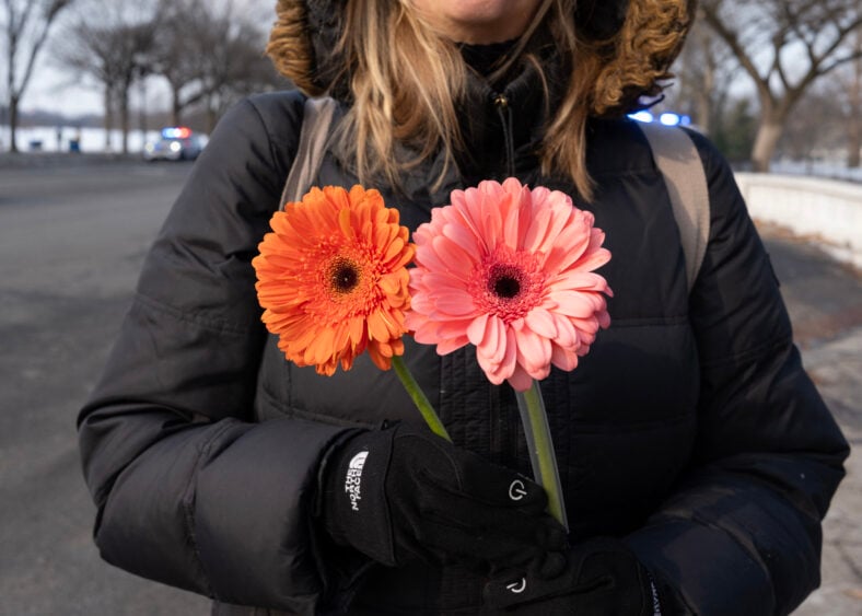 Person holding flowers