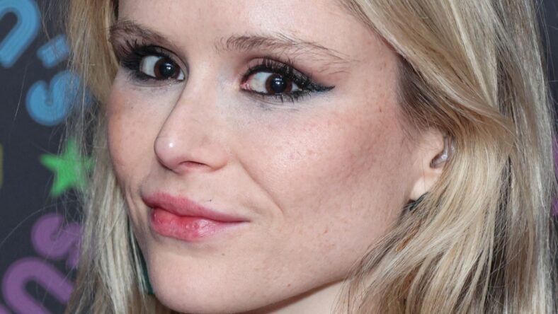 Erin Moriarty Sunbathing Topless Told They ‘Sit Pretty’ While Smiling