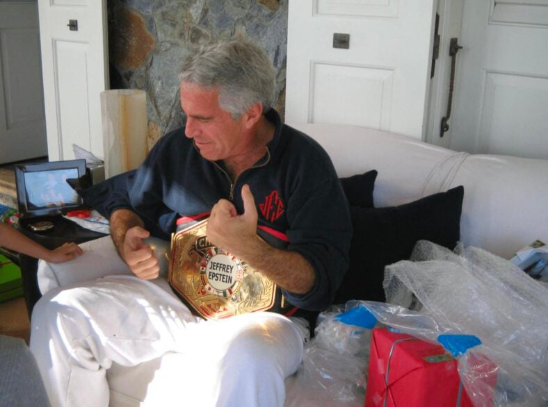 Jeffrey Epstein posing with a 'Champion' Belt with his name on it and with what appears to be a child in these undated photo released by the U.S. Department of Justice