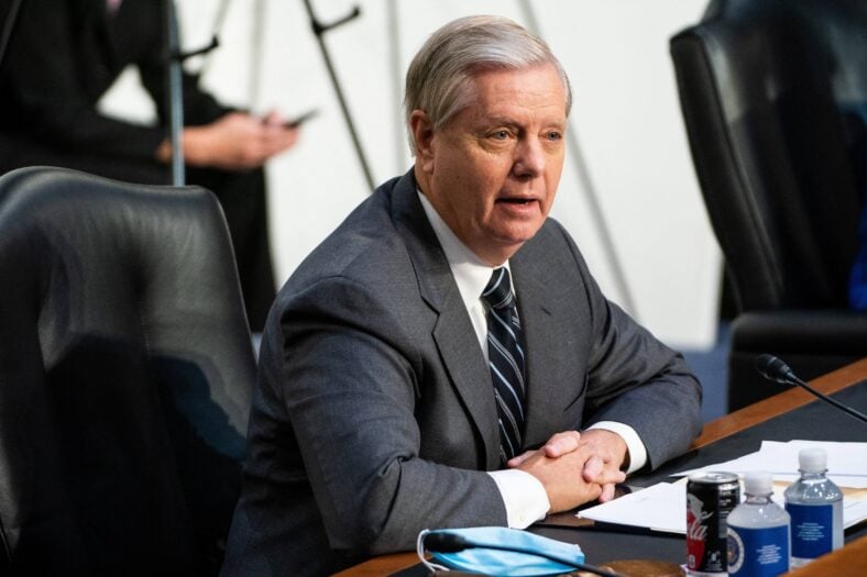 United States Senator Lindsey Graham (Republican of South Carolina) listens as Loretta Lynch, United States Attorney For The Eastern District Of New York,
