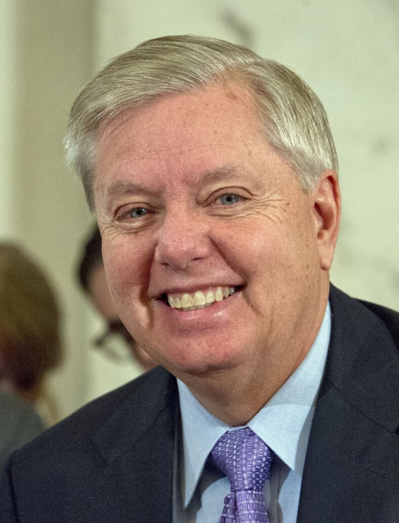 United States Senator Lindsey Graham (Republican of South Carolina) listens as Loretta Lynch, United States Attorney For The Eastern District Of New York