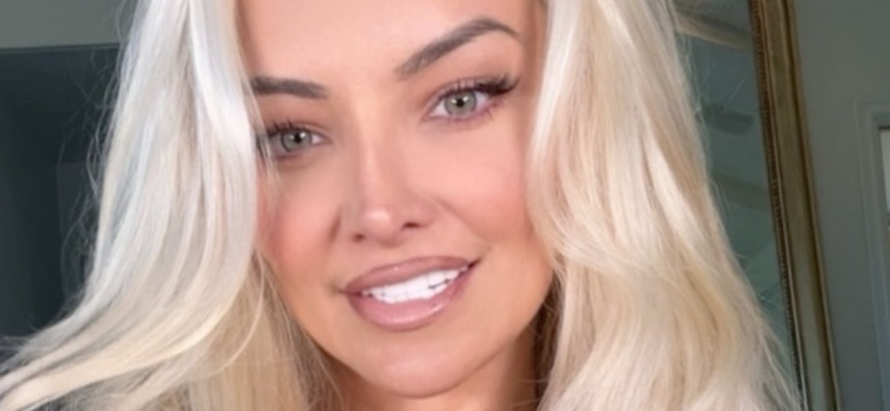 Lindsey Says ‘Hi’ While Spilling Out Her Plunging String Bikini