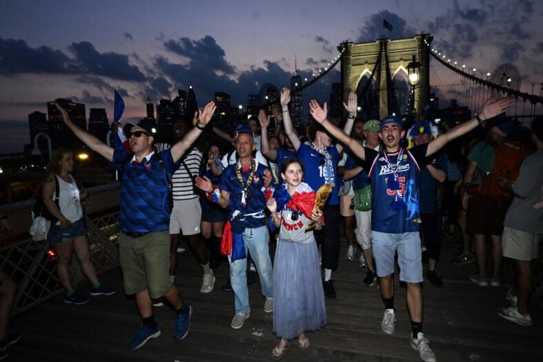 France fans in the World Cup come out on the Brooklyn Bridge to celebrate their Round of 32 match with Sweden