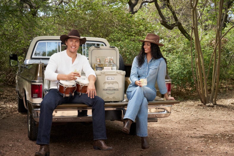 Matthew McConaughey and wife sitting on pick up truck