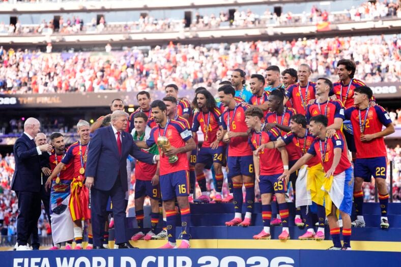 Donald Trump alongside Rodri Hernandez of Spain as team celebrates with the trophy after winning the 2026 FIFA World Cup