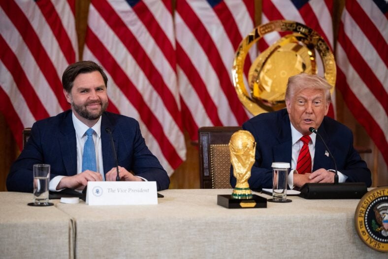 Donald Trump poses with the World Cup trophy