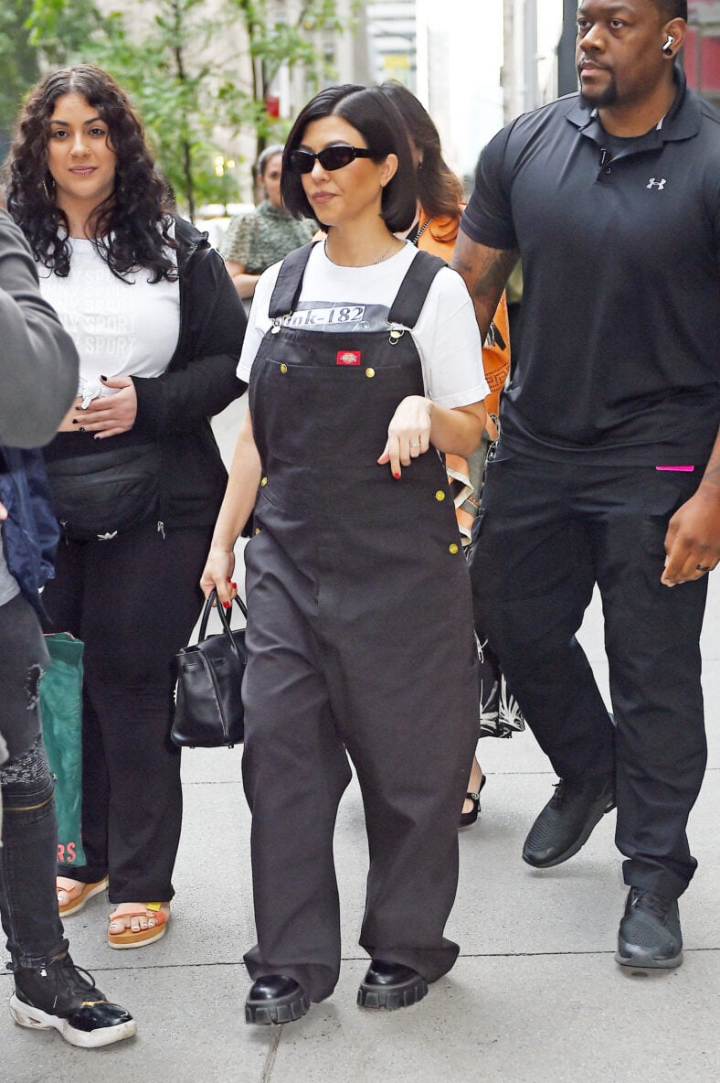 Kourtney Kardashian heads out in a Blink-182 t-shirt and overalls