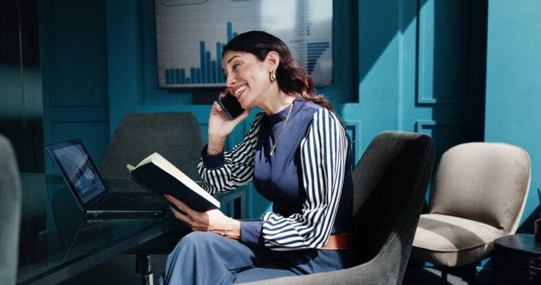 Notebook, financial advisor and woman with phone call for networking, asset management or budget advice. Portfolio manager, diary and negotiation in office for investment, deal and private equity.