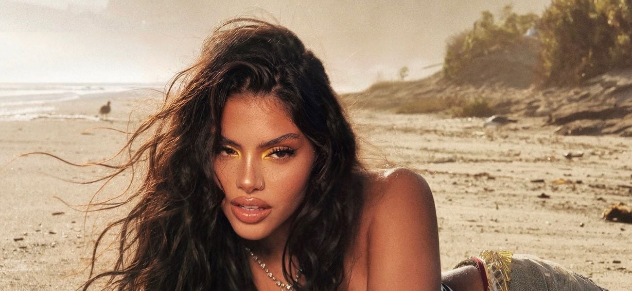 Huda Mustafa Nearly Bursts Out Of Corset And Plunging Romper
