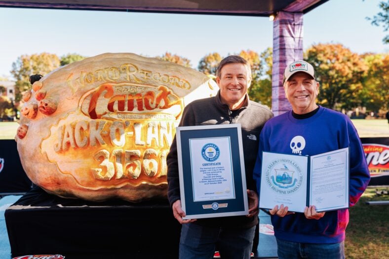 Raising Cane's owner and founder Todd Graves completes carving for Guiness World Record heaviest Jack o'lantern at Salem Common on October 27, 2026