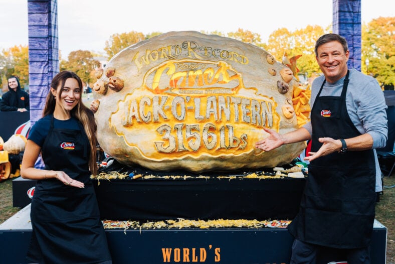 Raising Cane's owner and founder Todd Graves completes carving for Guiness World Record heaviest Jack o'lantern at Salem Common on October 27, 2026