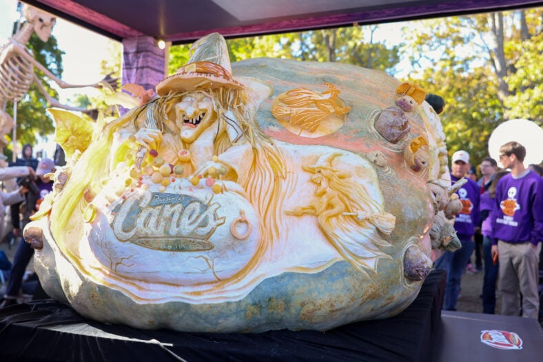 Raising Cane's owner and founder Todd Graves completes carving for Guiness World Record heaviest Jack o'lantern at Salem Common on October 27, 2026