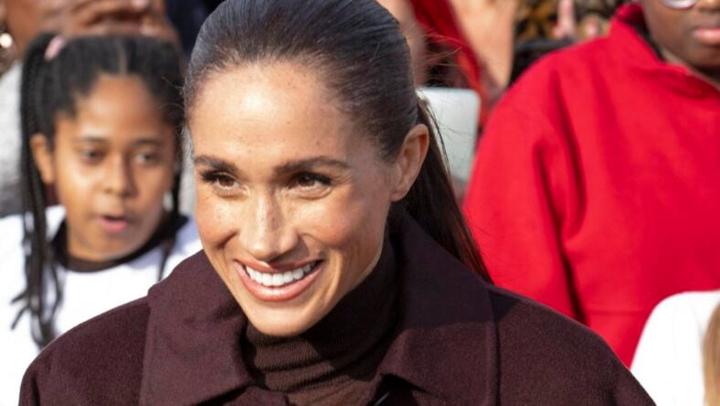 The Woman Behind Meghan Markle’s Viral Food Bank Moment Isn’t Who Fans Thought