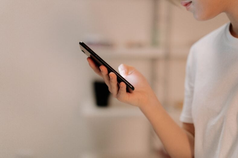 A lady holding a phone